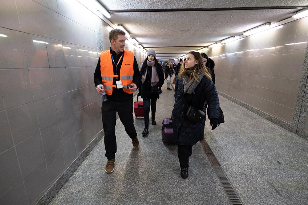 Volunteers help new arrivals at the station.