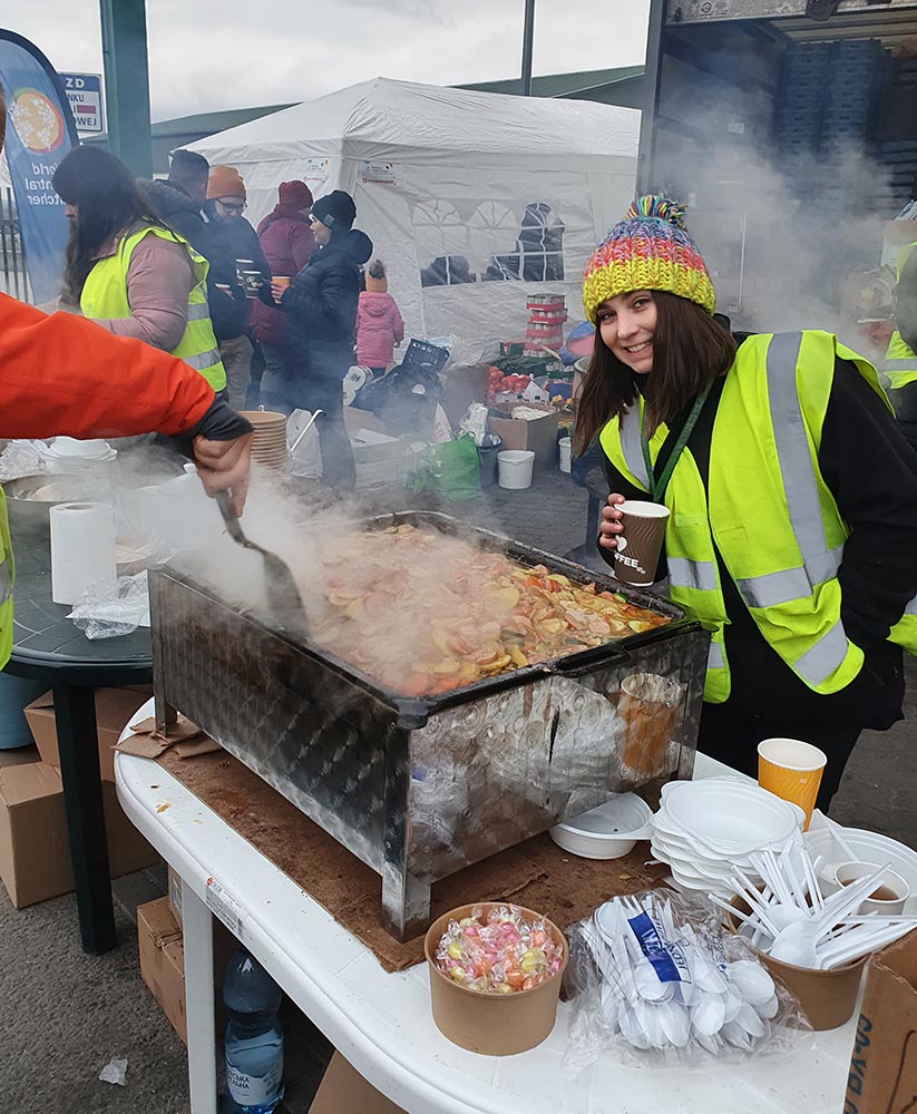 Volunteers make food at the border.